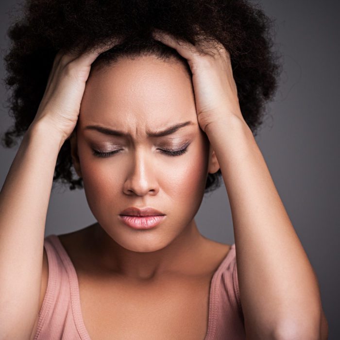 Woman with a Headache Treatment for TMJ and Bruxism Northborough MA