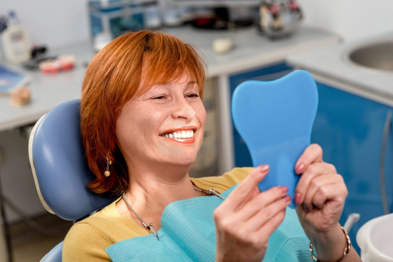 woman in the dental office with new denture northborough ma